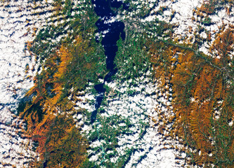 Aerial image of areas of northeast New York including Elizabethtown and the Adirondack Mountains showing off autumn foliage, clouds from above. Digitally enhanced. Elements of image furnished by NASA