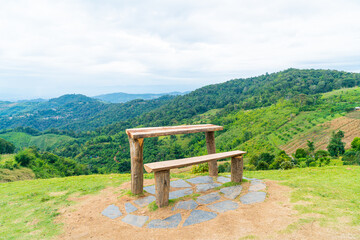 wood bar and chair with mountain hill background