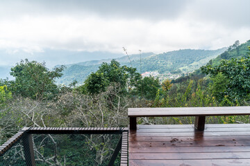 Fototapeta premium wood bar and chair with mountain hill background