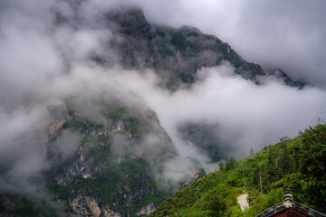 Clouds around Tiger Leaping Gorge, a scenic canyon on the Jinsha River, a primary tributary of the upper Yangtze River in China. It's one of the deepest and most spectacular river canyons in the world