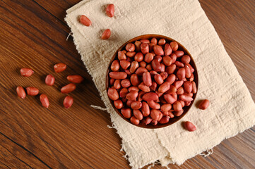RED Peanuts in wooden Peanuts in a bowl isolated