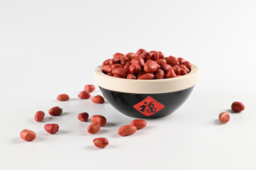RED Peanuts in wooden Peanuts in a bowl isolated