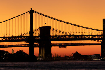 Sunset dusk view of the Manhattan and Brooklyn Bridge. 