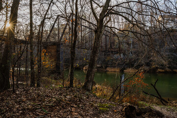 old bridge over river through the woods