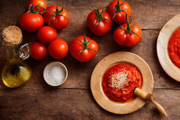 Pasta with tomato sauce shot from above on rustic wood table