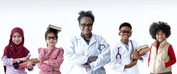 Multi racial teacher and student showing happy smiles against white background, doctor and boy wears lab coat and stethoscope, medical and science education concept