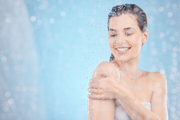 Cleaning, shower and woman with water in studio on blue background for beauty, wellness and body care. Spa hydration, skincare and happy girl washing for self care, health and hygiene in water drops