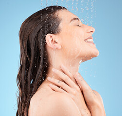 Water splash, shower and woman cleaning on blue background for healthy skincare, cosmetics and...