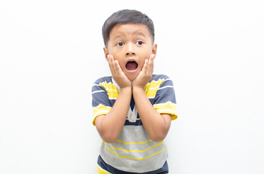 Portrait Of Wow Shocked Happy Asian Little Boy Posing Yes Gesture With Raising His Fist Shows Growing Up And Strong.