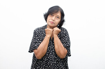 Portrait of happy ecstatic senior asian woman in overjoyed,surprised and shocked expression