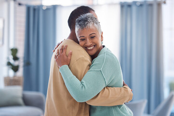 Hug, love and trust with a senior couple bonding in the living room of their home together. Happy,...