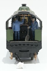 Fototapeta na wymiar The driver and fireman in a model locomotive which is OO scale. 