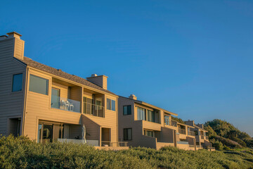 Fototapeta na wymiar Houses with balconies against blue sky at scenic Del Mar Southern Califronia.