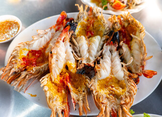 fresh grilled shrimps, grilled fresh giant river prawns, cutting half shrimp burn served with Seafood salad.
