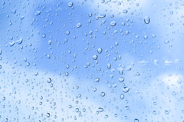 rainy season concept, a raindrop on the glass surface, water drops texture background, raining Day, wet texture background, Abstract water.