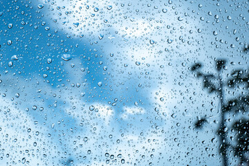 rainy season concept, a raindrop on the glass surface, water drops texture background, raining Day, wet texture background, Abstract water.