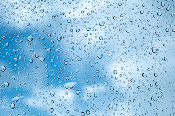 rainy season concept, a raindrop on the glass surface, water drops texture background, raining Day, wet texture background, Abstract water.