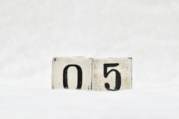 05 calendar date number, white snowy winter background copy space