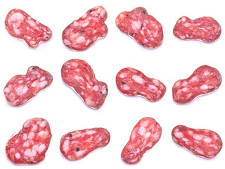 slices of Spanish Fuet thin dried salami sausage isolated on a white background