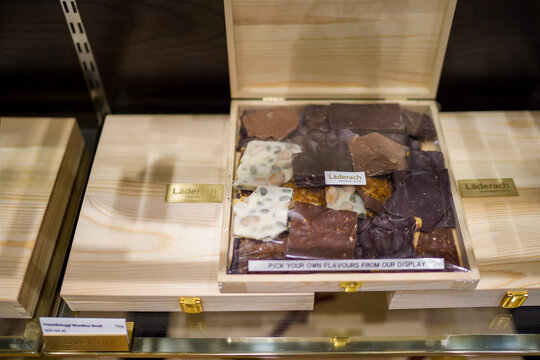 SINGAPORE - May 09, 2019: Wooden box of Switzerland famous Laderach chocolate display in the Jewel Changi store.