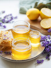 Obraz na płótnie Canvas Jar with honey and fresh lavender flowers