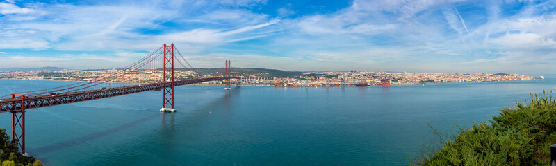 The 25 de Abril Bridge is a bridge, Lisbon Portugal. Panoramic view