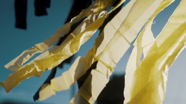 Yellow Paper Tassel Garlands Of Giant Kite Blowing With The Wind In Sumpango, Guatemala. - close up