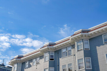 Apartment building with painted gray concrete tiles wall cladding in San Francisco, California