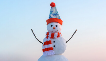 Funny snowman on the snow outdoor background. Christmas winter banner with snowman. New year greeting card with with snowman.