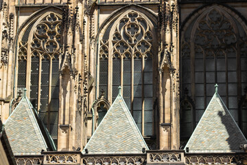 Fragments and window of St. Vitus cathedral in gothic style in Prague Castle complex, Czech...