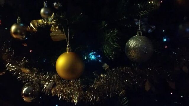 Colorful lights on a Christmas tree. Video with Christmas tree