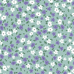 Cute floral pattern. Seamless vector texture. An elegant template for fashionable prints. Print with small white and lilac flowers .green background.