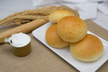 Fresh fragrant bread and bun on the table with copy space. Food concept