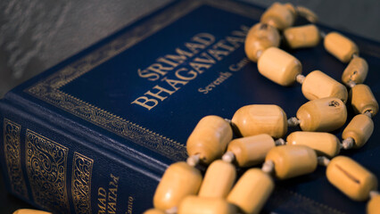 Srimad Bhagavatam and rosary close up.