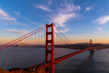 Golden Gate Bridge at sunset with high clouds