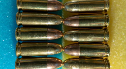 Fototapeta premium Bullets 9 mm, coat of arms and flag of Ukraine