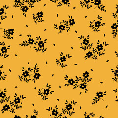 Cute floral pattern. Seamless vector texture. An elegant template for fashionable prints. Print with small black flowers and leaves. orange background.