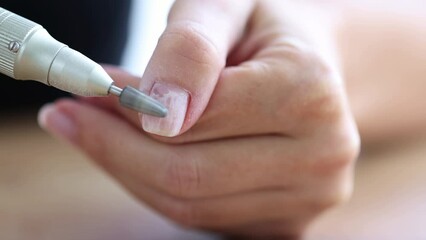 Removing shellac from the nails with fraser. Closeup. Selective focus. 4K