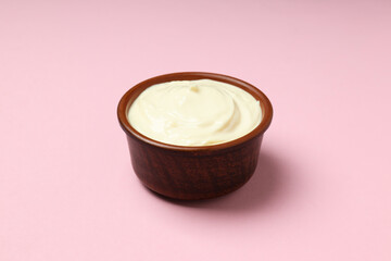 Concept of egg sauce, mayonnaise sauce on pink background