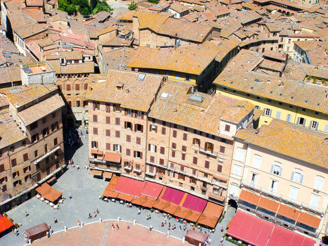 View from above of town and square on a summer day. Siena. Italy.