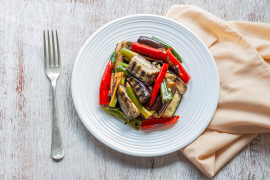 Healthy Food Eggplant Salad Has Bell Pepper In Plate On White Wood Table.