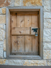 San Antonio, Texas- Wood window cover with padlock