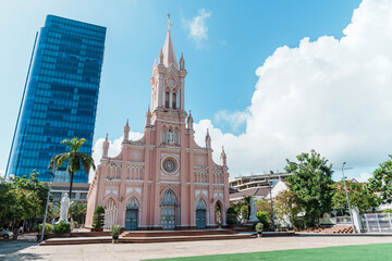 Fototapeta na wymiar Pink Da Nang Cathedral church. Landmark and popular for tourist attraction. Vietnam and Southeast Asia travel concept