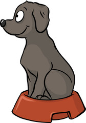 Fototapeta premium Niedlicher kleiner Welpe sitzt und wartet artig in seinem Futternapf