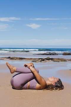 Apanasana Knees To Chest Pose Yoga On The Beach