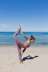 dancer pose natarajasana yoga on the beach