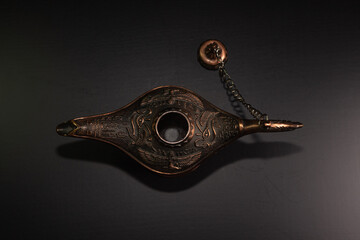 Aladdin's magic lamp isolated on black background