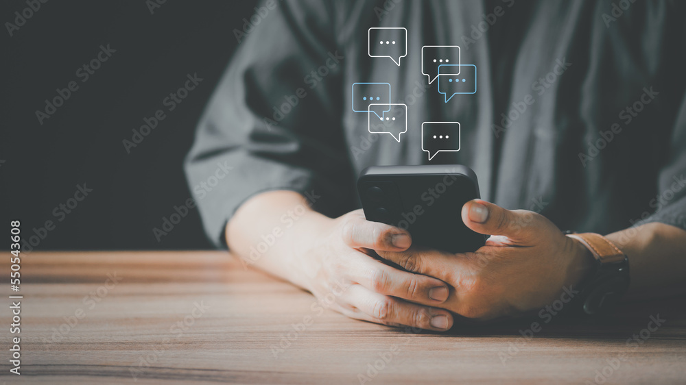 Poster Man hand using smartphone typing live chat chatting on application communication digital web and social network concept. Social media application chat box.