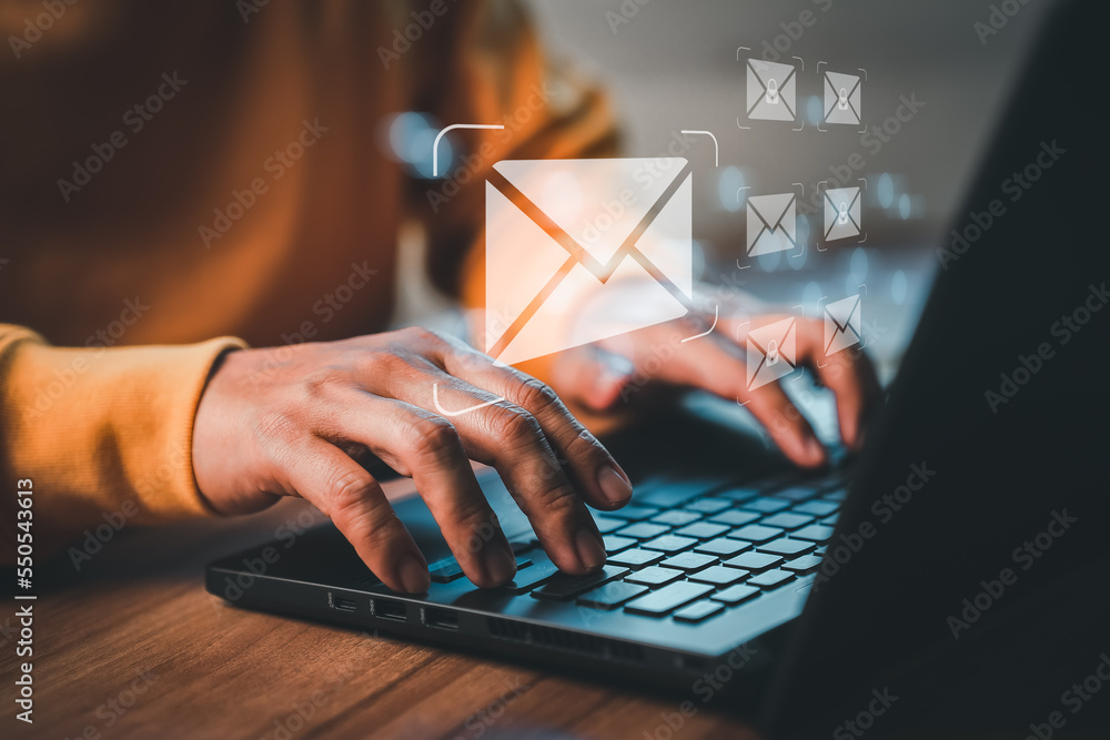 Poster Freelancer's hand using computer laptop and sending online message with email icon, email marketing concept, send email or newsletter, internet network working online.
