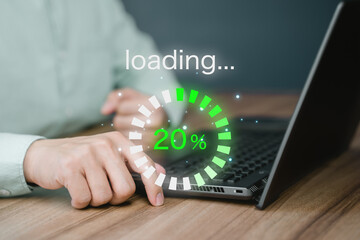 Man using laptop for download software and waiting to loading digital business data form website, concept of waiting for load of loading bar. - obrazy, fototapety, plakaty